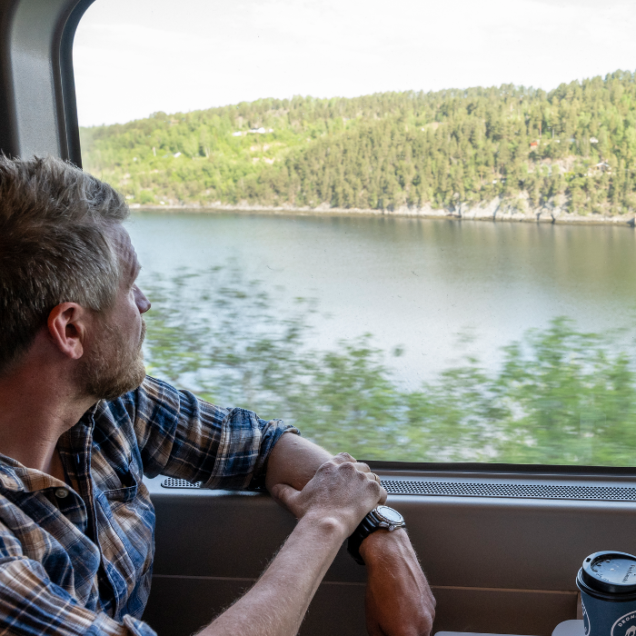 Man sitting on the train in the Nordland railway